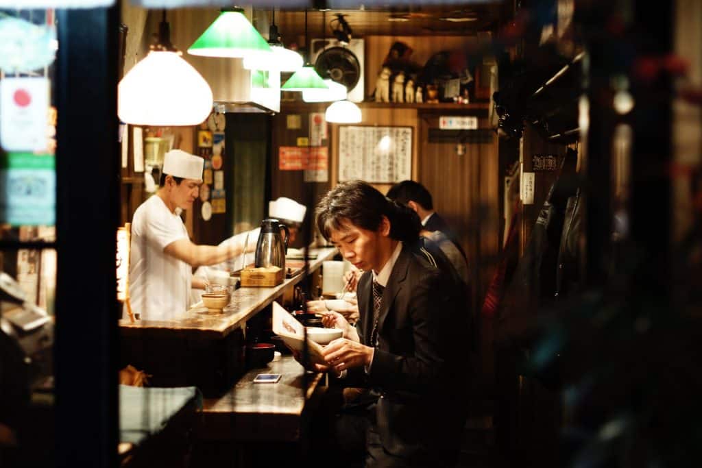 Japanese man eating in a ramen shop